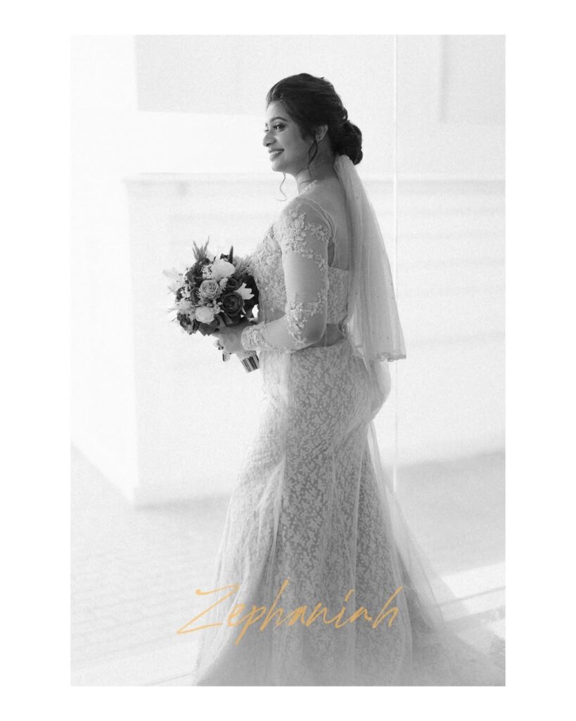 Bride wearing a designer bridal gown in Kochi boutique